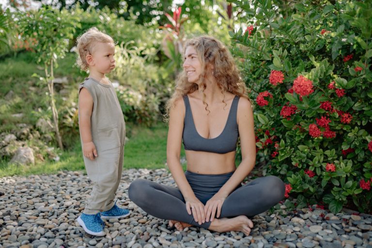mother-with-child-in-bright-garden